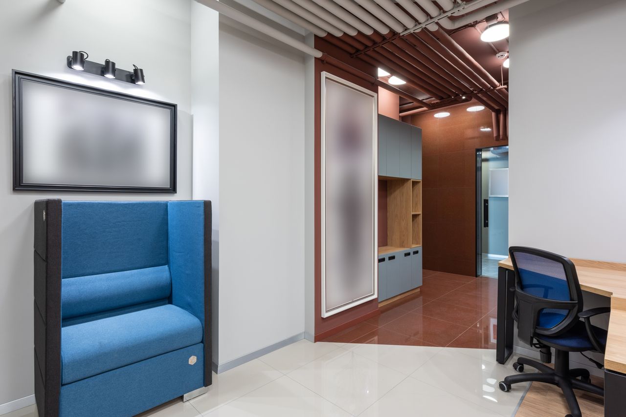 team-03 Contemporary office environment with modern seating and workspace setup, ideal for productivity.
